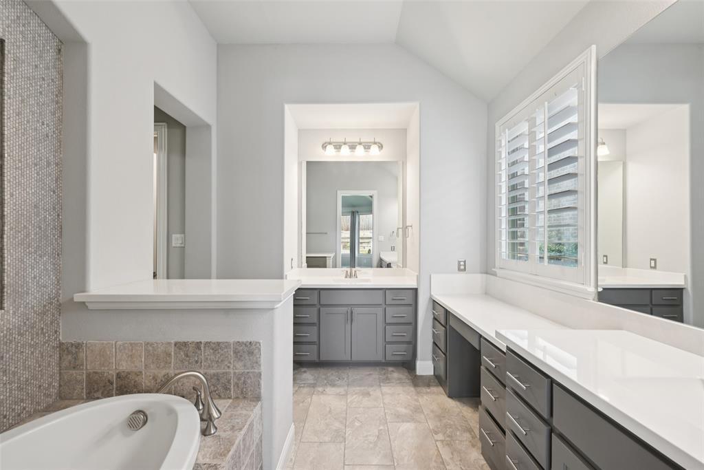 3415 Secretariat Place Celina, TX 75009 - Photo 17 of 40 a spacious bathroom with a granite countertop tub sink and mirror