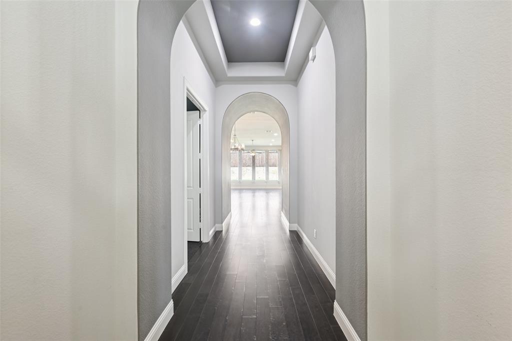 3415 Secretariat Place Celina, TX 75009 - Photo 25 of 40 a view of a hallway with wooden floor