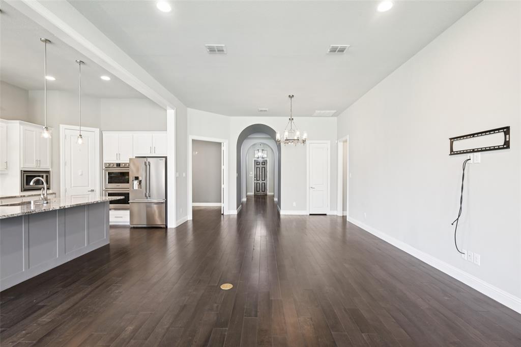 3415 Secretariat Place Celina, TX 75009 - Photo 28 of 40 a view of a large kitchen with wooden floor