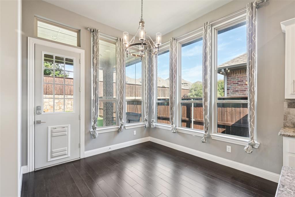 3415 Secretariat Place Celina, TX 75009 - Photo 29 of 40 a view of an empty room with a window and wooden floor