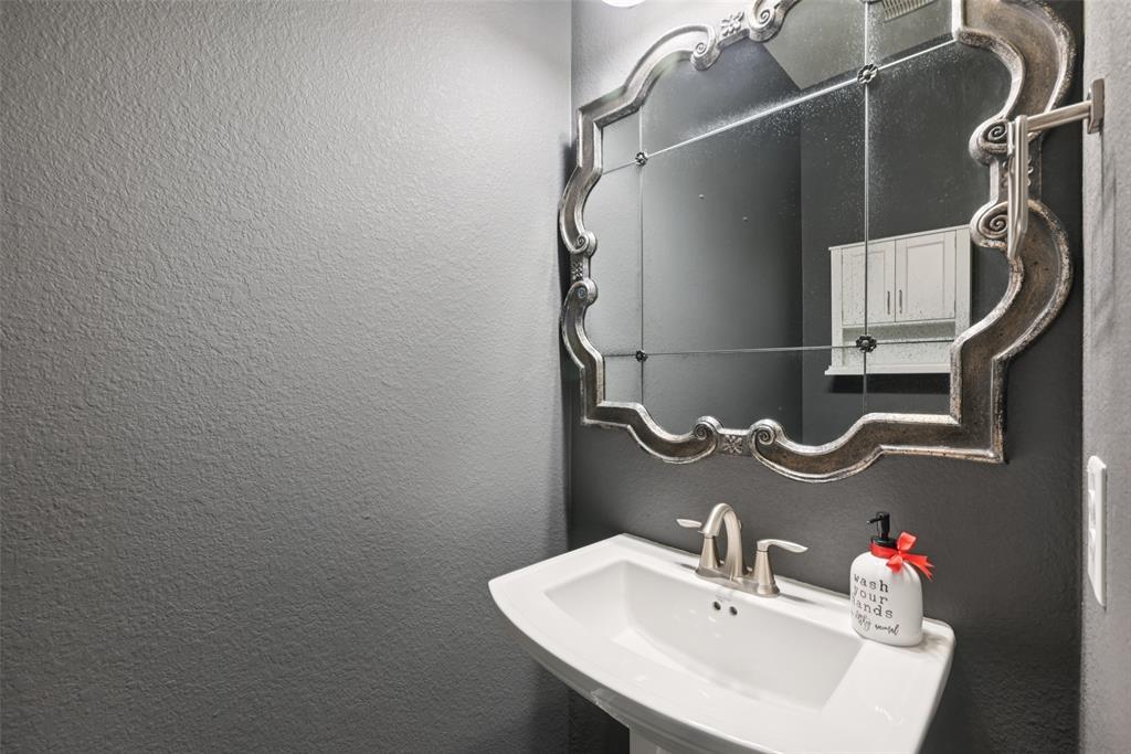 3415 Secretariat Place Celina, TX 75009 - Photo 36 of 40 a bathroom with a sink and mirror