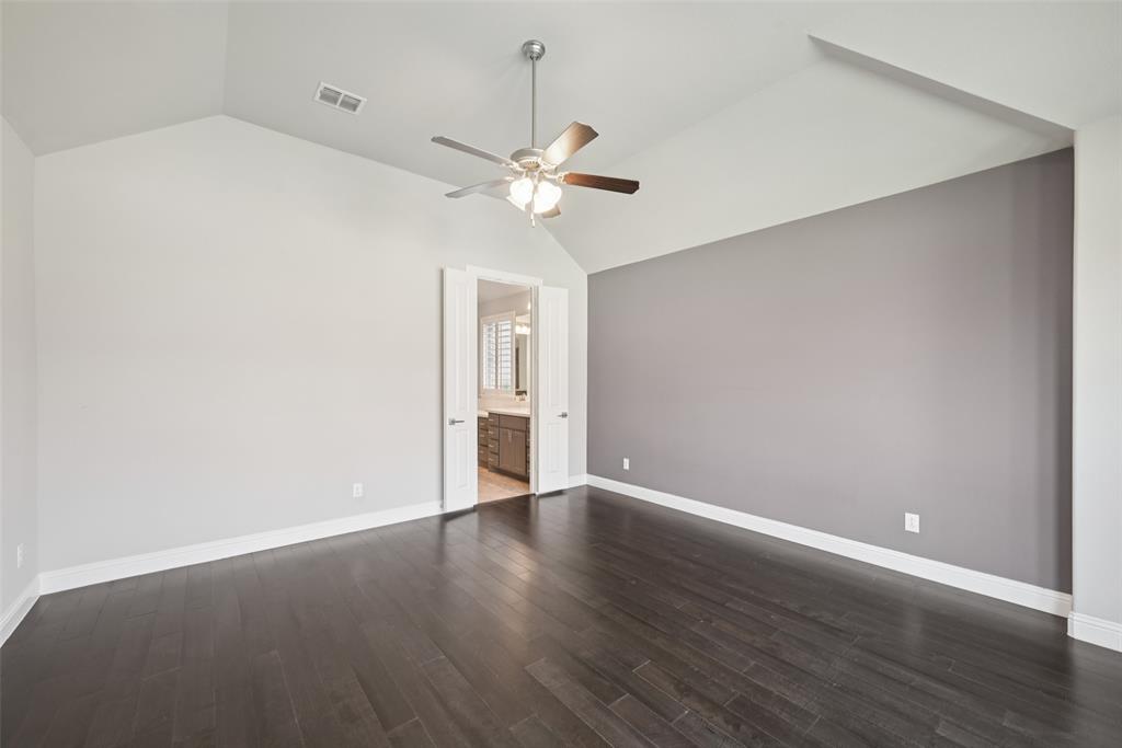 3415 Secretariat Place Celina, TX 75009 - Photo 39 of 40 an empty room with wooden floor fan and windows