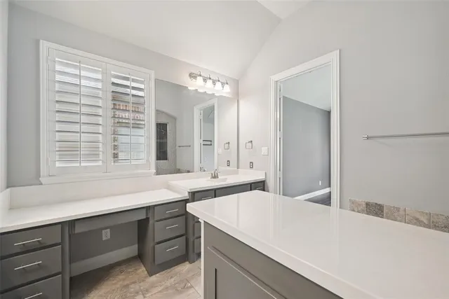 a kitchen with a sink and a window