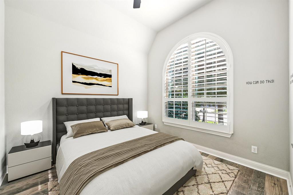 3415 Secretariat Place Celina, TX 75009 - Photo 8 of 40 a bedroom with a bed and a painting on the wall