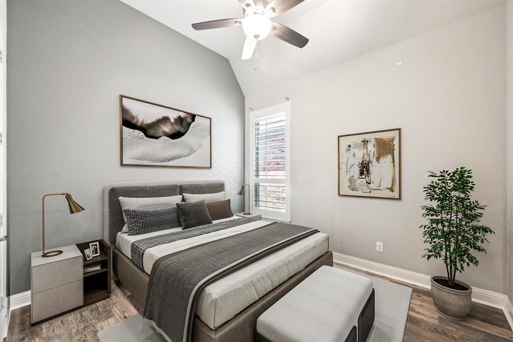 3415 Secretariat Place Celina, TX 75009 - Photo 9 of 40 a bedroom with a bed and a potted plant