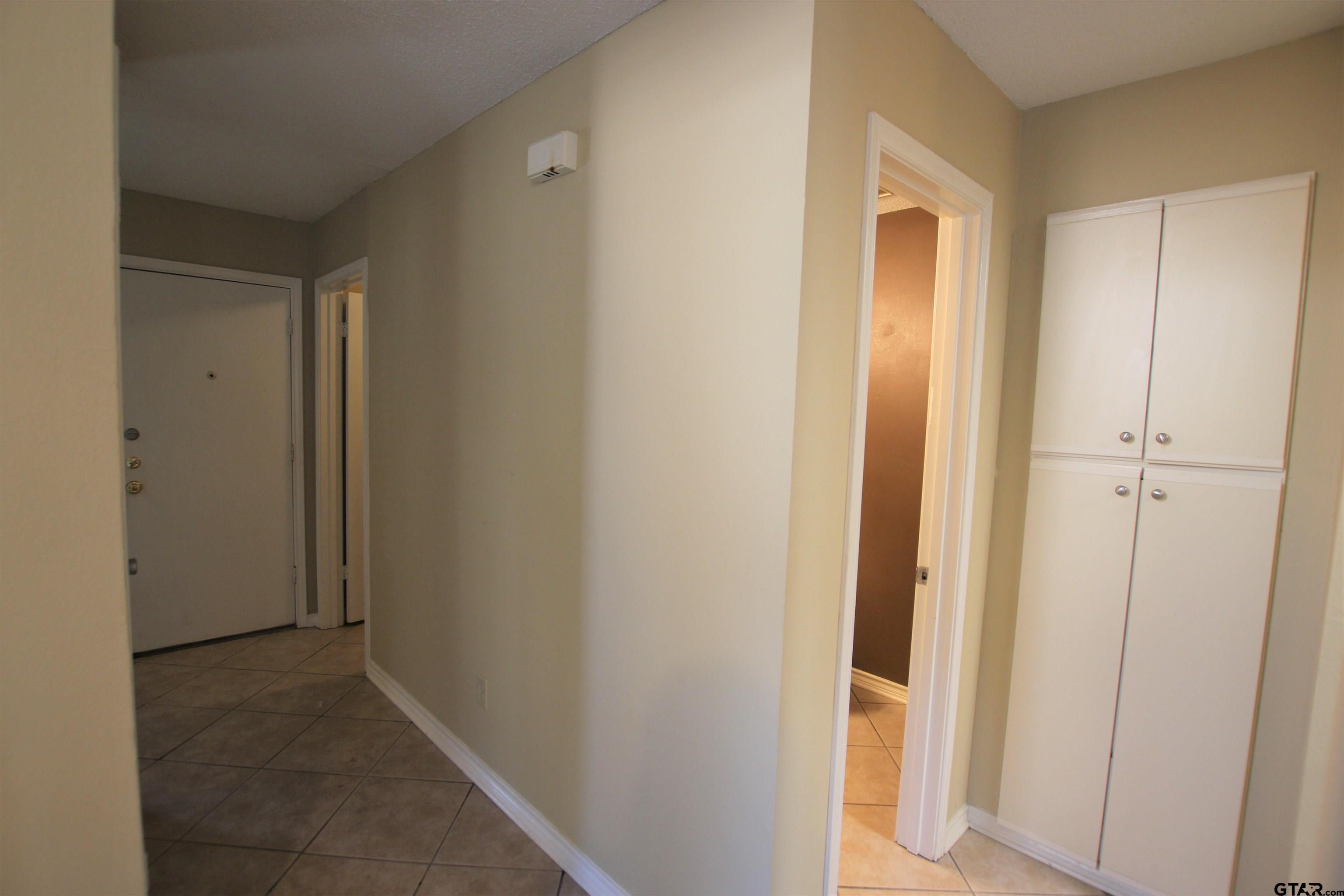 5875 Creekside Circle Tyler, TX 75703 - Photo 15 of 32 a view of a hallway with closet area