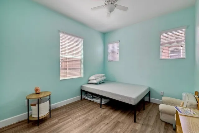 a bedroom with a workspace