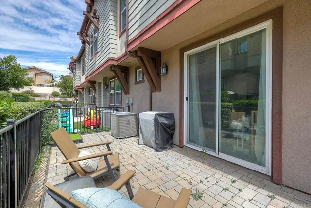 a view of a chairs and table in the patio