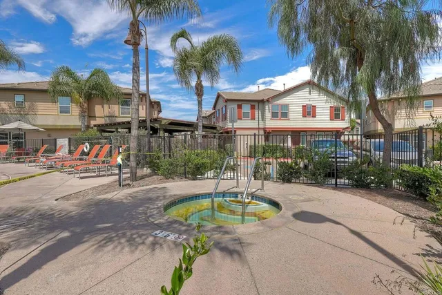 an aerial view of a house with a yard and balcony