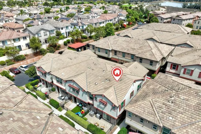 an aerial view of residential houses with outdoor space