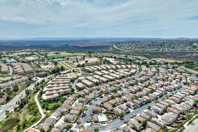 an aerial view of residential house and green space