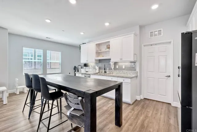a kitchen with a table and chairs in it