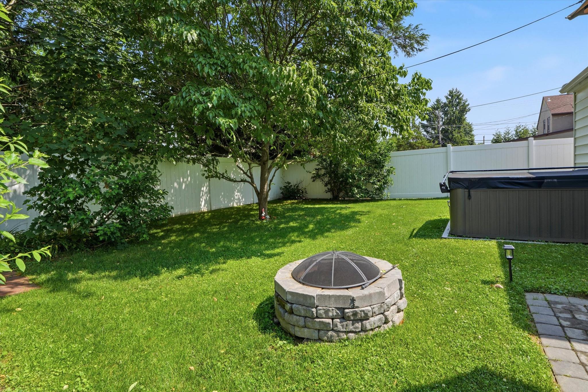 408 Maplewood Road Springfield, PA 19064 - Photo 21 of 24 View of dogwood tree and fire pit