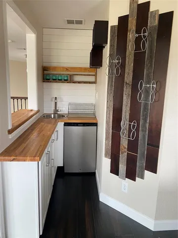 a bathroom with a sink and mirror