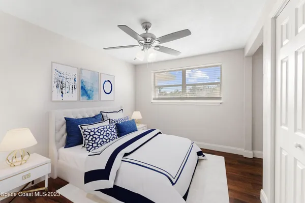 a bedroom with furniture and a window