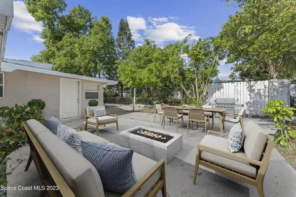 a view of a patio with couches and potted plants