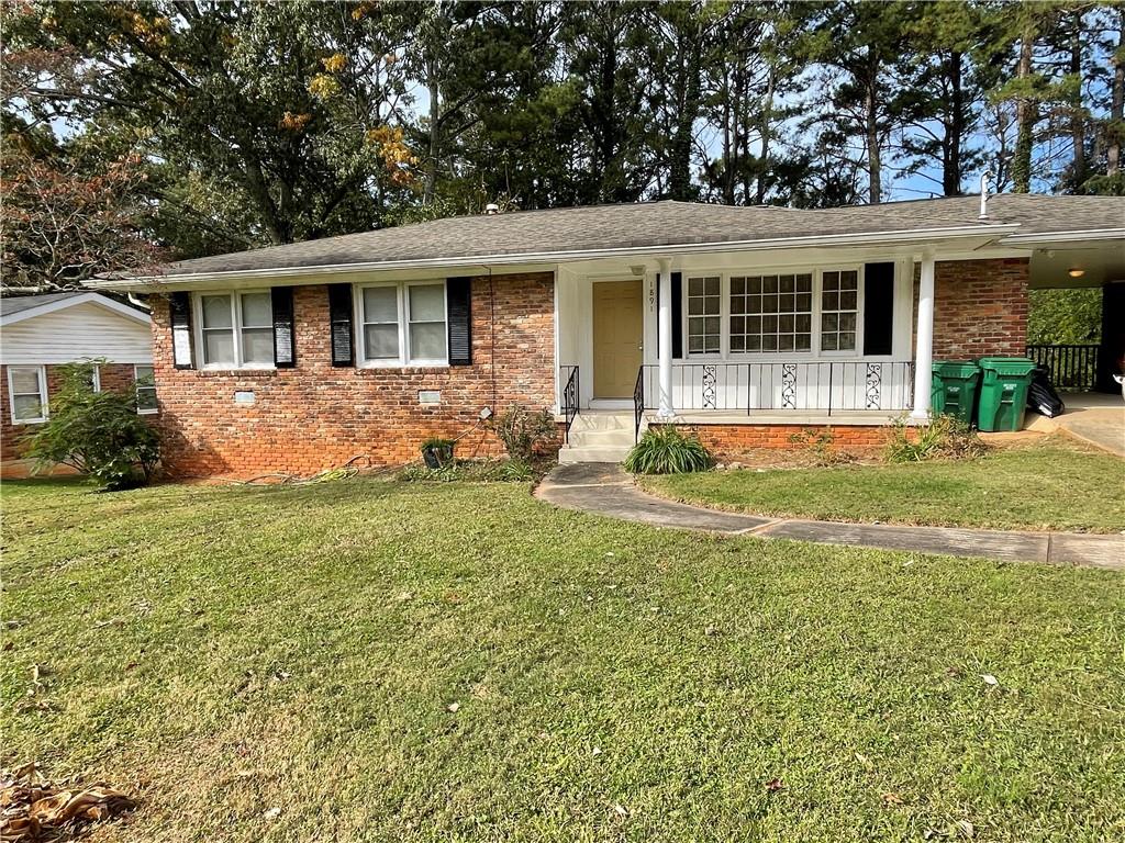 1891 Janet Lane Decatur, GA 30035 - Photo 1 of 1 a front view of house with yard and green space