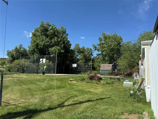 a swimming pool with outdoor seating and yard