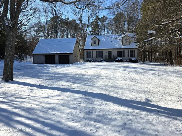 a front view of a building with a garden