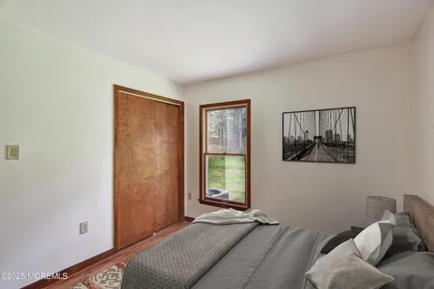 a bed room with a bed and a window