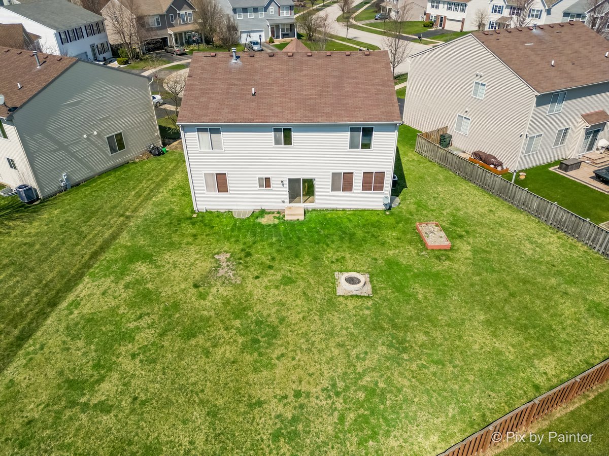 1106 Port Royal Road Pingree Grove, IL 60140 - Photo 33 of 36 an aerial view of a house with a yard
