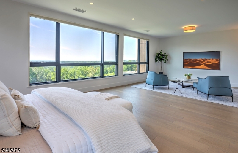 51 Abby Road Peapack, NJ 07977 - Photo 15 of 31 a spacious bedroom with a large bed and a large window