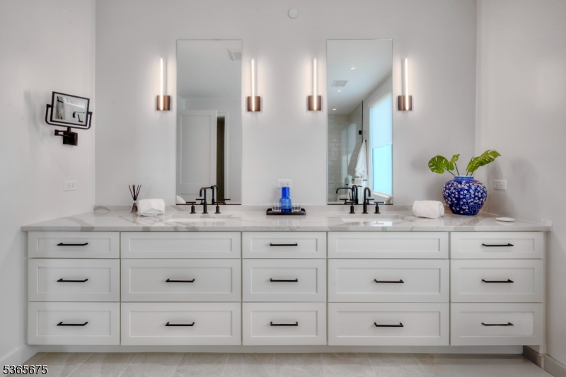 51 Abby Road Peapack, NJ 07977 - Photo 17 of 31 a bathroom with a sink double vanity and a mirror