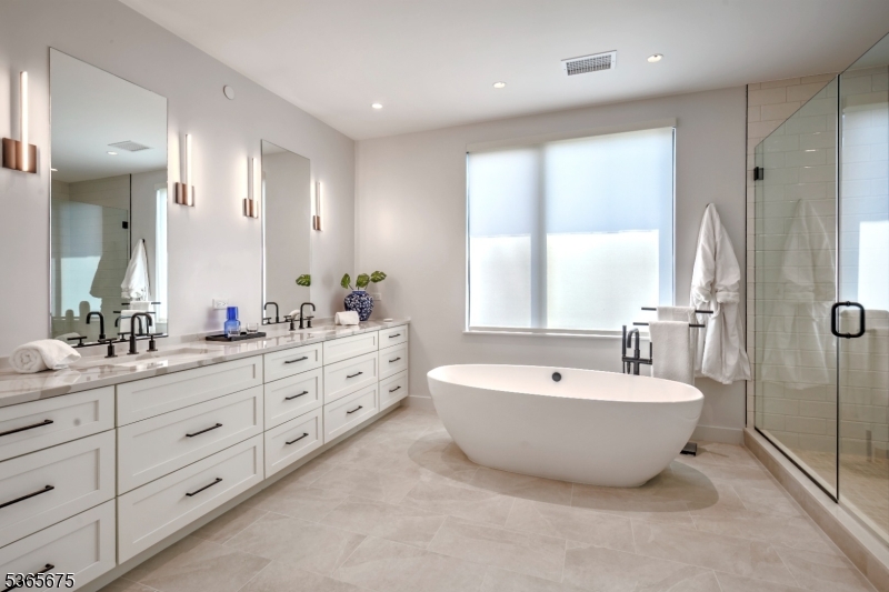 51 Abby Road Peapack, NJ 07977 - Photo 18 of 31 a spacious bathroom with a double vanity sink mirror and bathtub