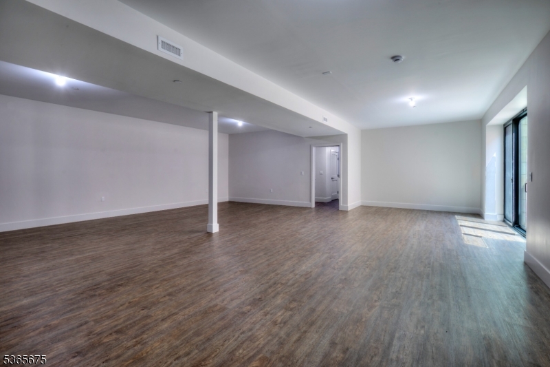 51 Abby Road Peapack, NJ 07977 - Photo 29 of 31 a view of an empty room with wooden floor