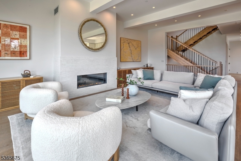 51 Abby Road Peapack, NJ 07977 - Photo 4 of 31 a living room with furniture a fireplace and a wall painting