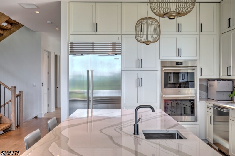 51 Abby Road Peapack, NJ 07977 - Photo 7 of 31 a kitchen with furniture a window and stainless steel appliances