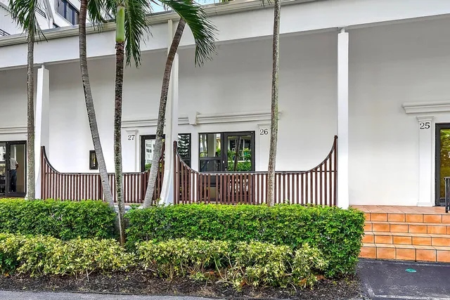 a view of a house with a fence