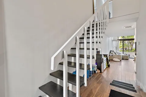 a view of staircase with lots of wooden floor