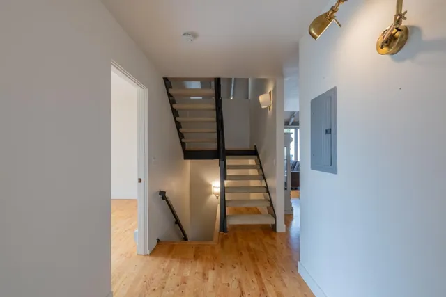a view of entryway with wooden floor