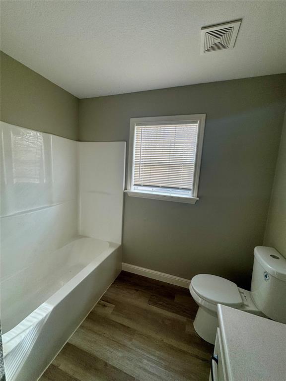 301 Fairview Street Pittsburg, TX 75686 - Photo 10 of 13 a bathroom with a sink and a toilet