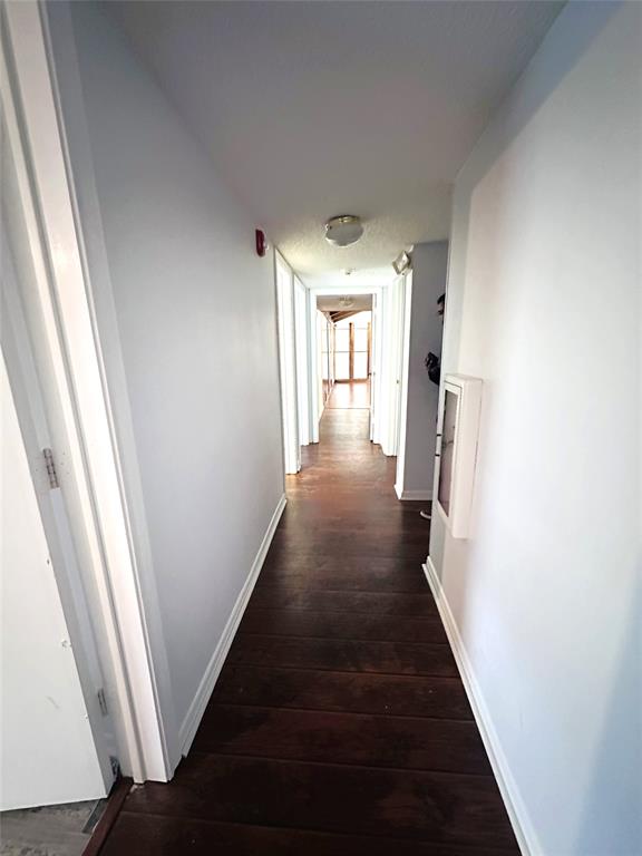 722 East Wheatland Road Duncanville, TX 75137 - Photo 25 of 40 a view of a hallway with wooden floor and staircase