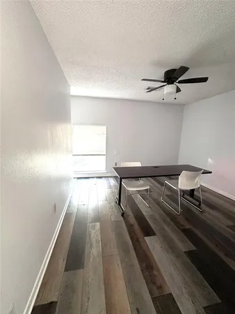 a living room with couch and a rug