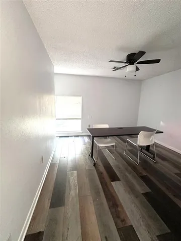 a living room with couch and a rug
