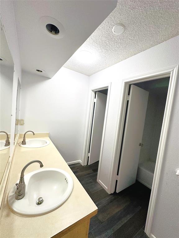 722 East Wheatland Road Duncanville, TX 75137 - Photo 40 of 40 a bathroom with a sink and a mirror