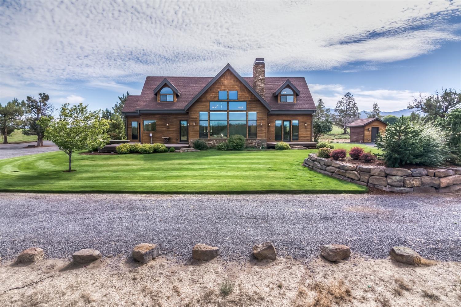 16794 Southwest Cronin Road Powell Butte, OR 97753 - Photo 1 of 25 Back side of the home has great deck and