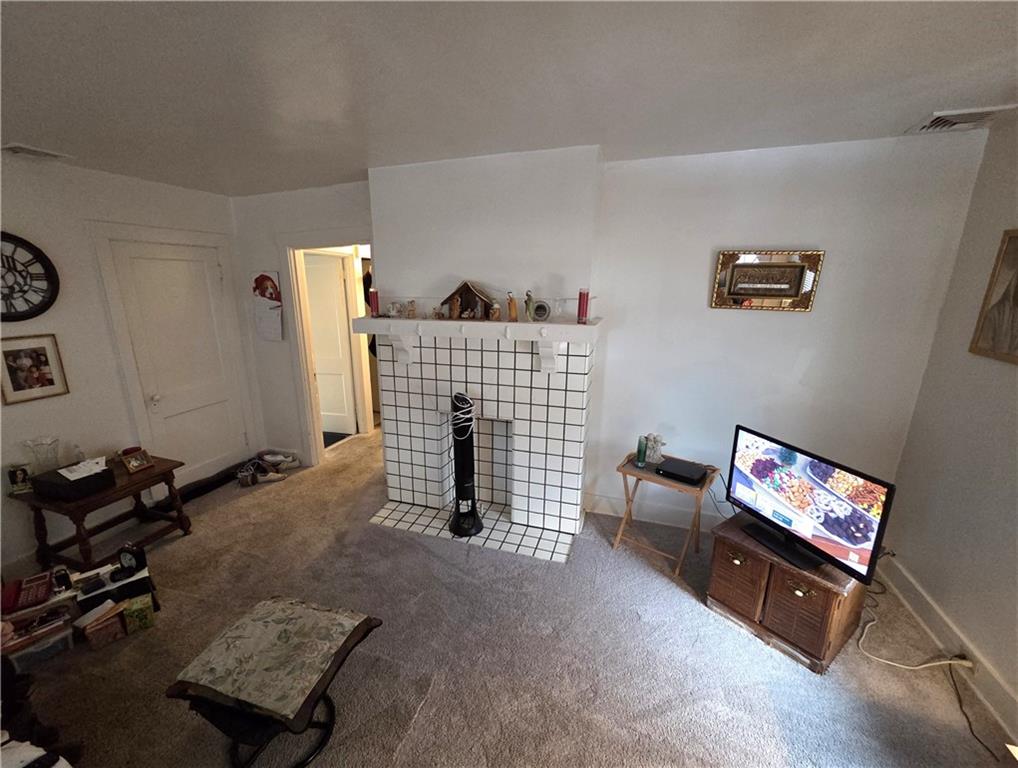 3520 Campus Street Pittsburgh, PA 15212 - Photo 11 of 26 a living room with furniture and a flat screen tv