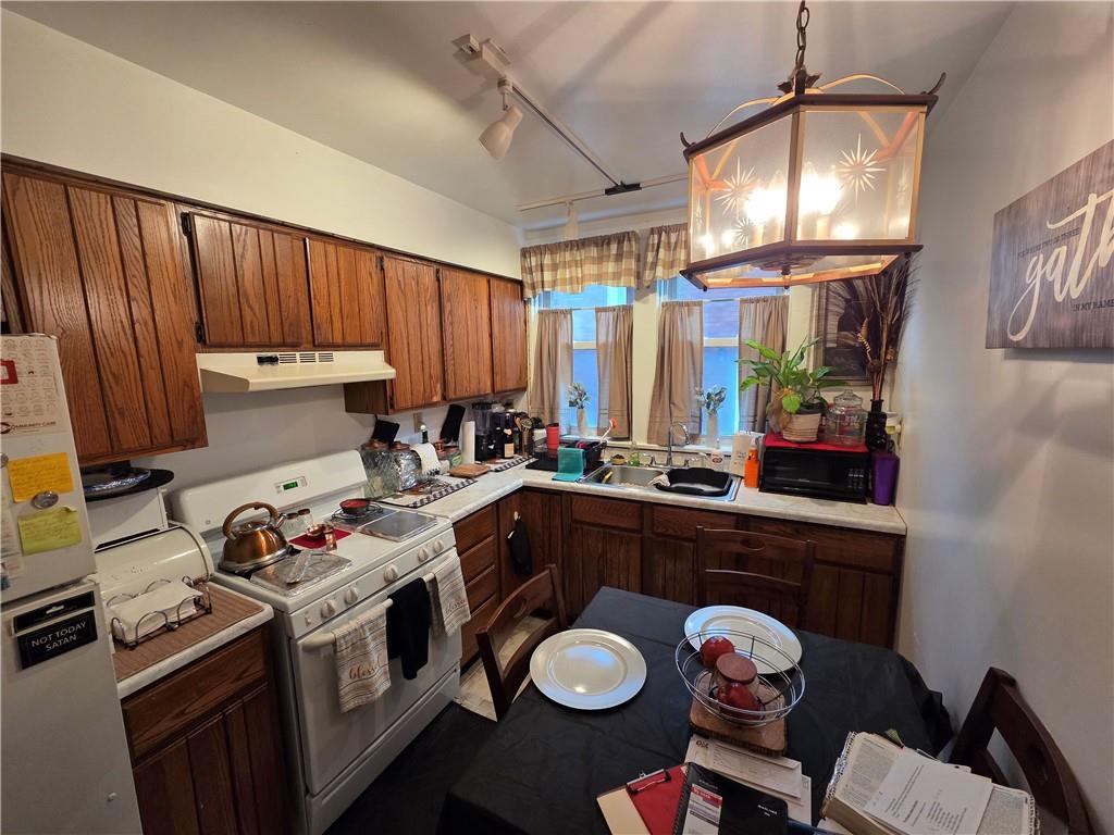 3520 Campus Street Pittsburgh, PA 15212 - Photo 16 of 26 a kitchen that has a sink cabinets and window
