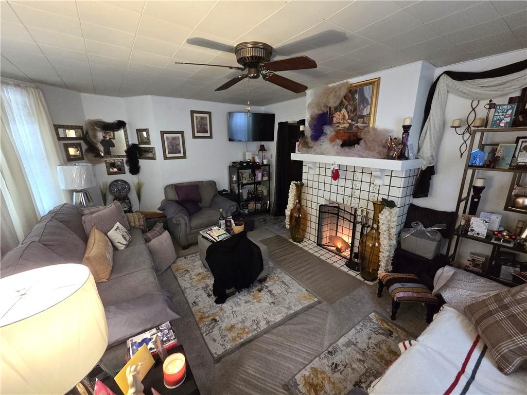 3520 Campus Street Pittsburgh, PA 15212 - Photo 18 of 26 a living room with furniture and a fireplace