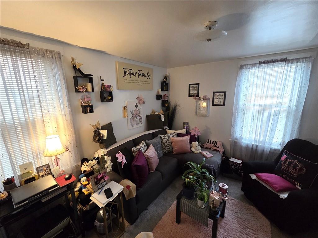 3520 Campus Street Pittsburgh, PA 15212 - Photo 21 of 26 a living room with furniture and a window