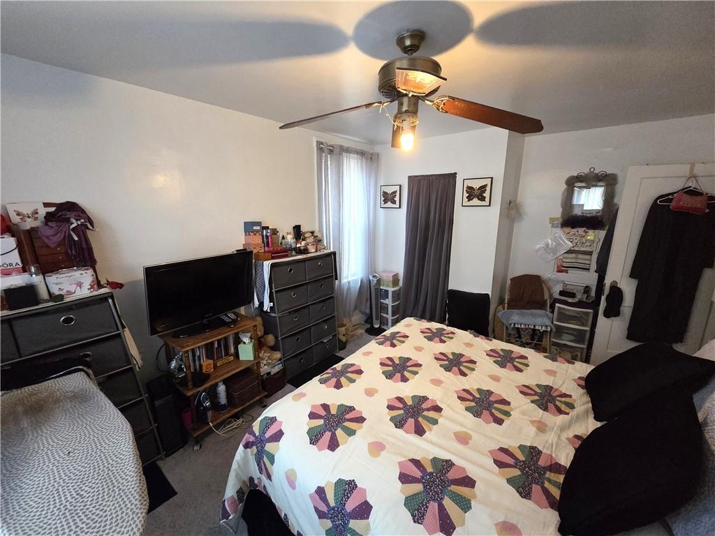 3520 Campus Street Pittsburgh, PA 15212 - Photo 23 of 26 a bedroom with a bed and a flat screen tv