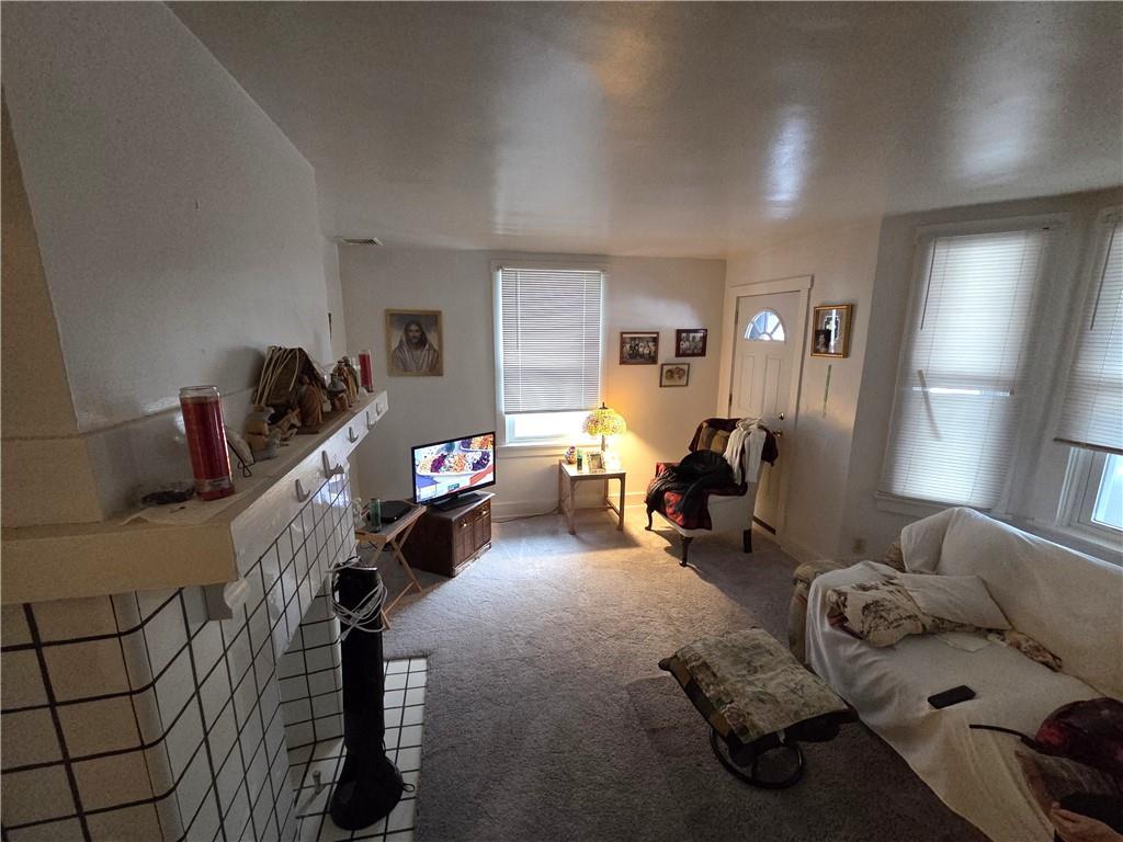 3520 Campus Street Pittsburgh, PA 15212 - Photo 10 of 26 a bed room with furniture and a window