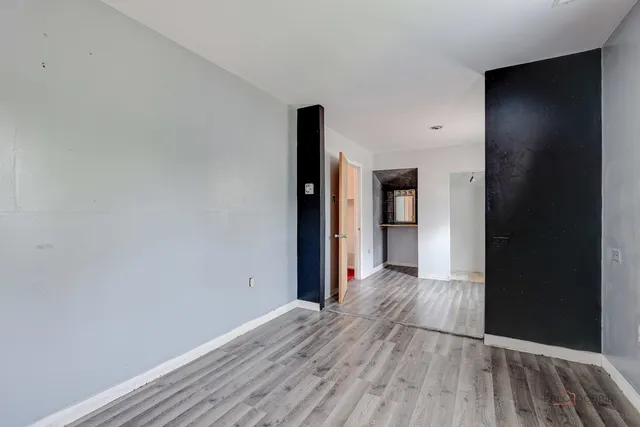 a view of a kitchen from the hallway
