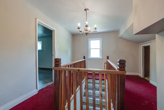 a view of an empty room with storage