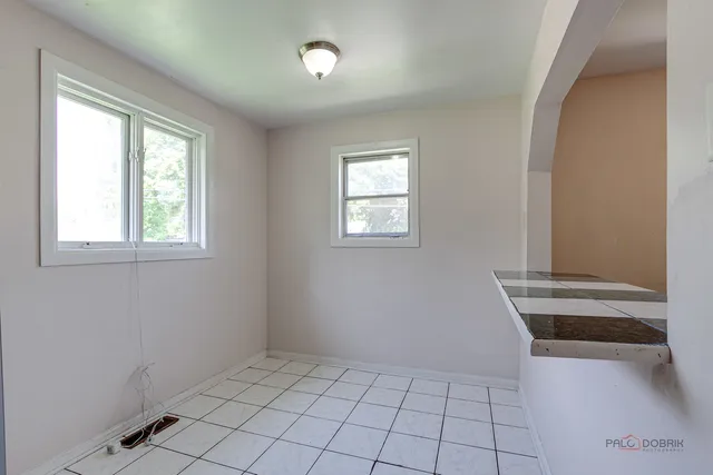 a view of an empty room and window