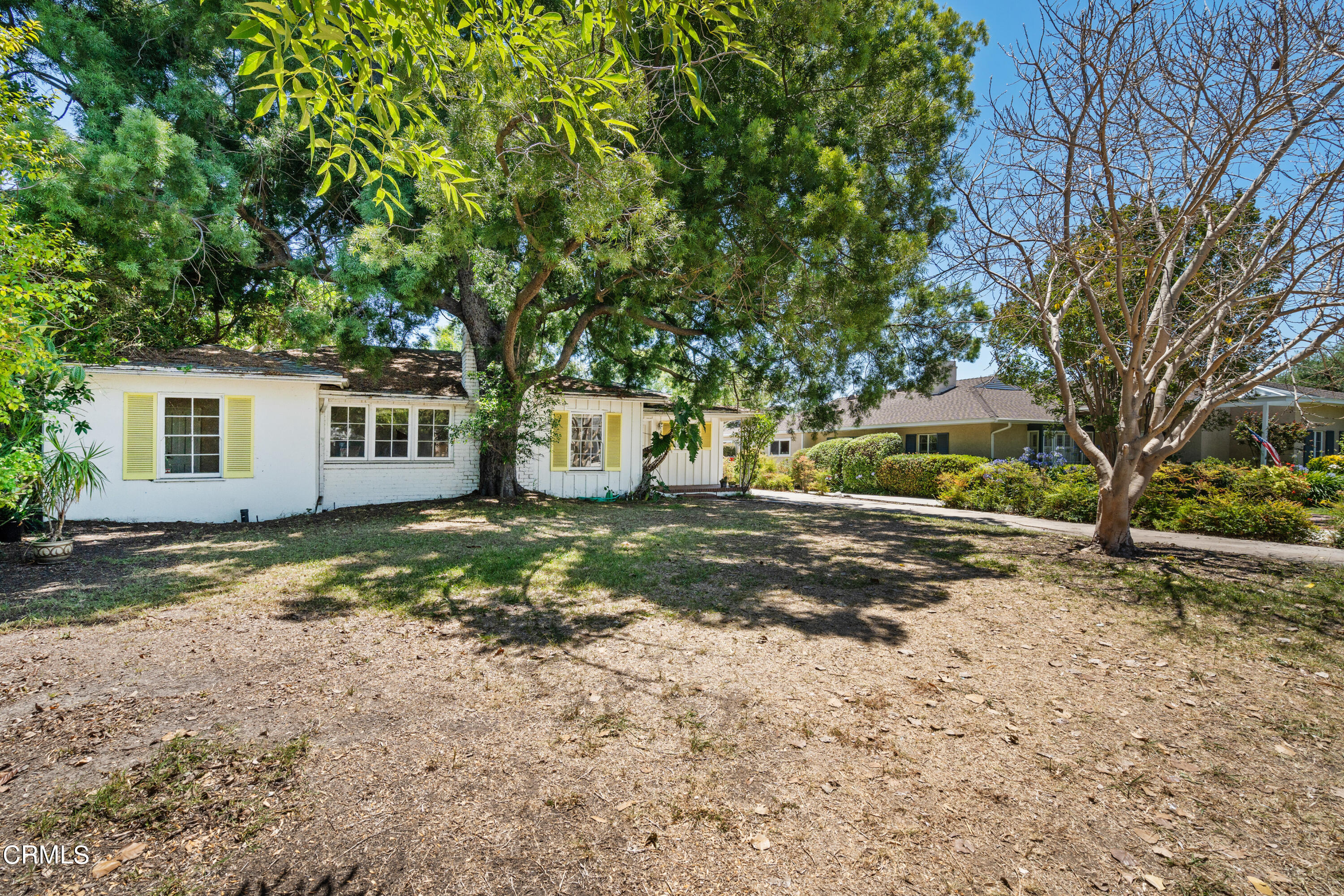 3254 Orlando Road Pasadena, CA 91107 - Photo 2 of 25 a backyard of a house with fountain table and chairs